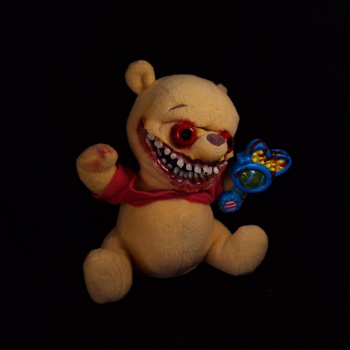 Winnie the pooh plushie with big smile, red eyes