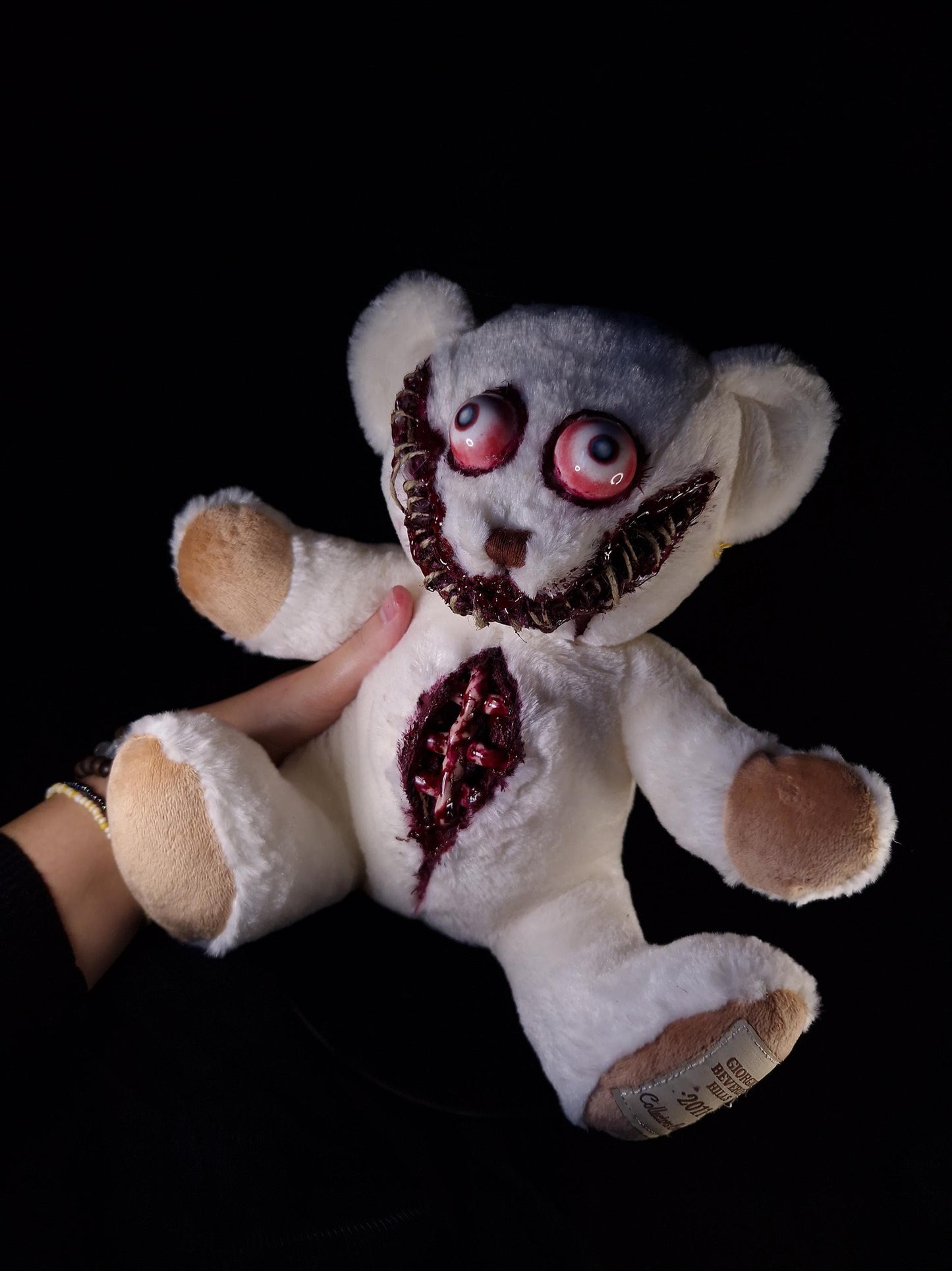Bloody sewed mouth teddy bear