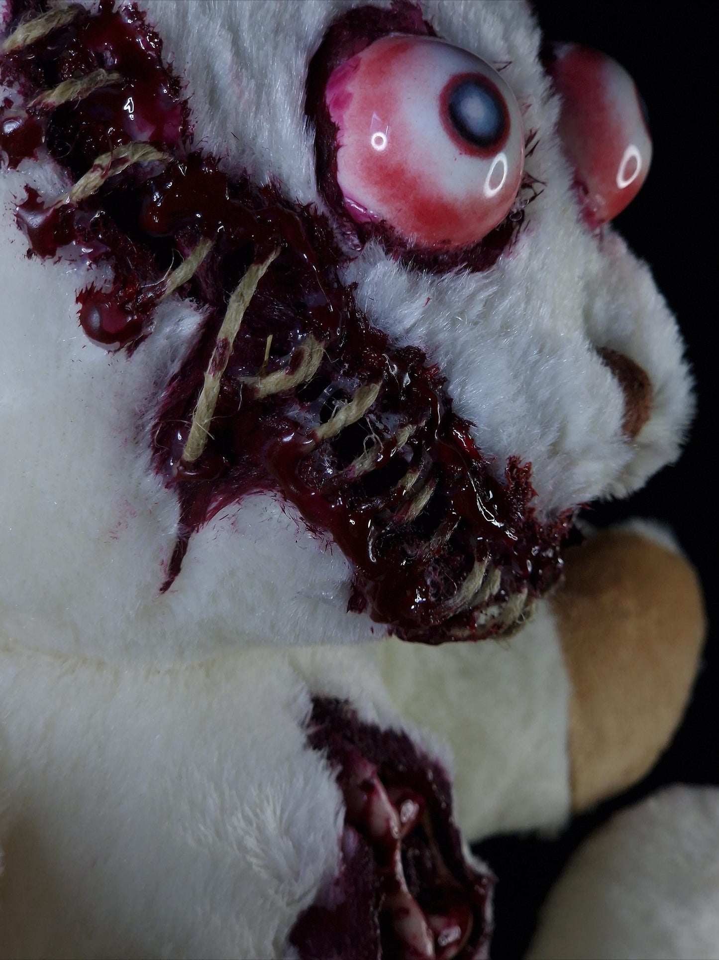 Bloody sewed mouth teddy bear