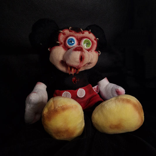 Mickey mouth with popping eyes, stitches and sharp teeth 