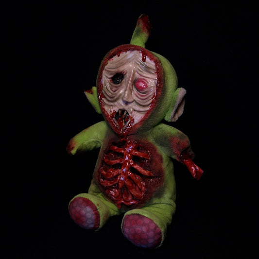 Dipsy teletubbie with a zombie face, bloody ribs with Intestines falling out, bone sticking out of his arm 