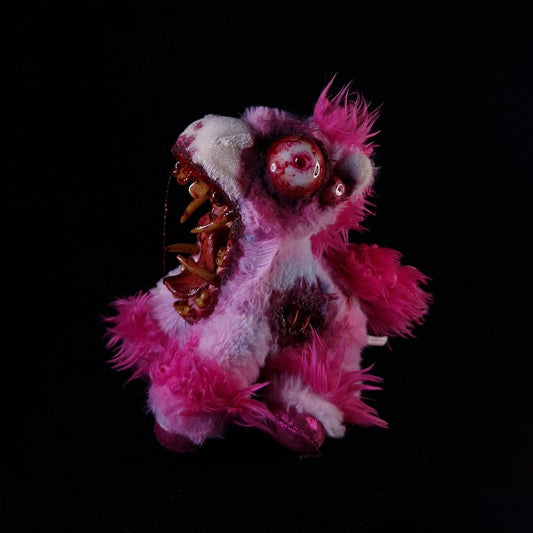 Creepy pink unicorn with 4 bloodshot eyes, sharp teeth and bloody Tongue