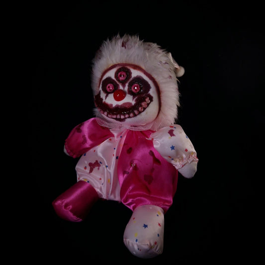 Clown with 3 red eyes and bloody smile 